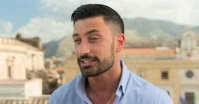 Giovanni Pernice speaks in front of a camera