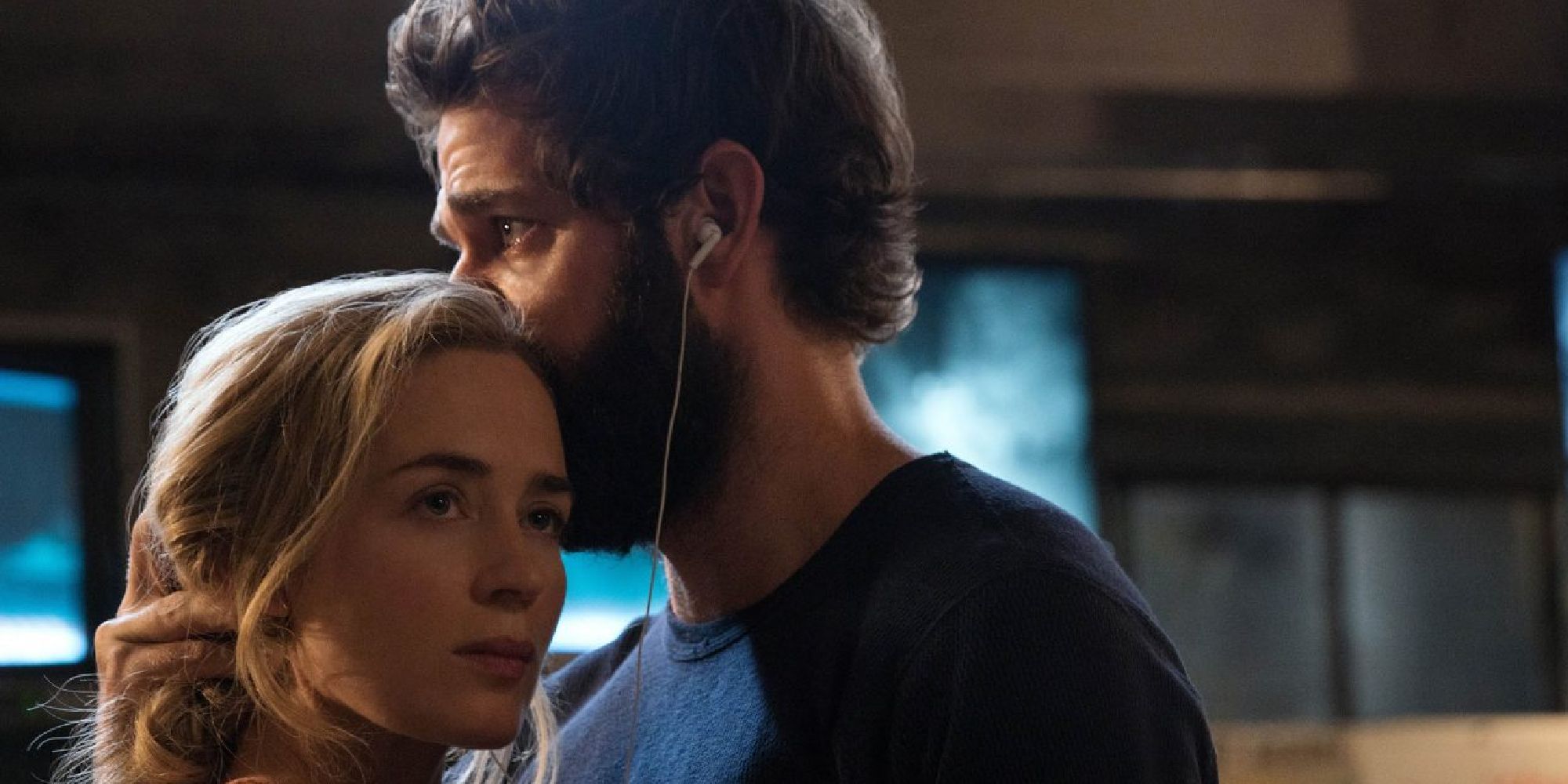 John Krasinski kisses Emily Blunt's head in A Quiet Place