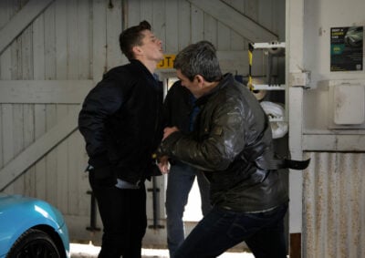 Cain punches Nicky in the stomach while Caleb watches Emmerdale