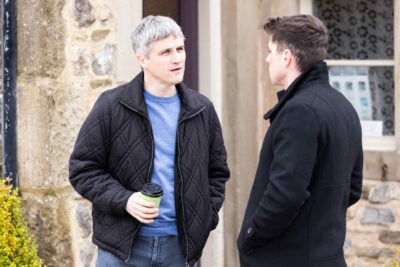 Nicky and Caleb chat in Emmerdale's beer garden